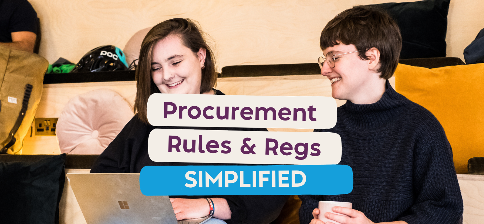 Two women chatting and laughing. rules & Regulations for Procurement in UK.